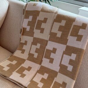 BaubleBar On Repeat “E” Throw Blanket